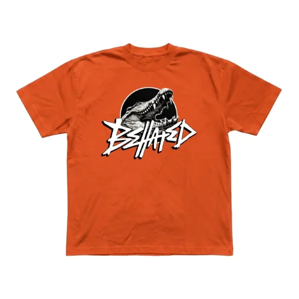 Orange t-shirt featuring the Behated band logo printed on the front.