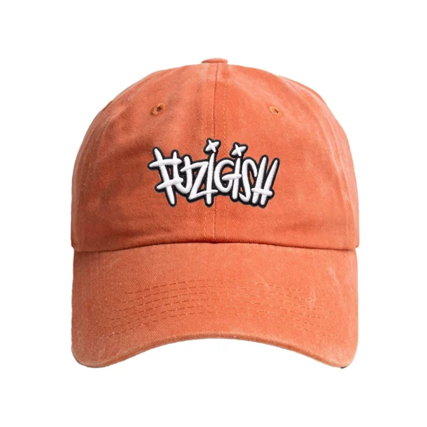 Enzyme-washed orange Fuzigish dad cap with white and black embroidered logo on the front - Front view