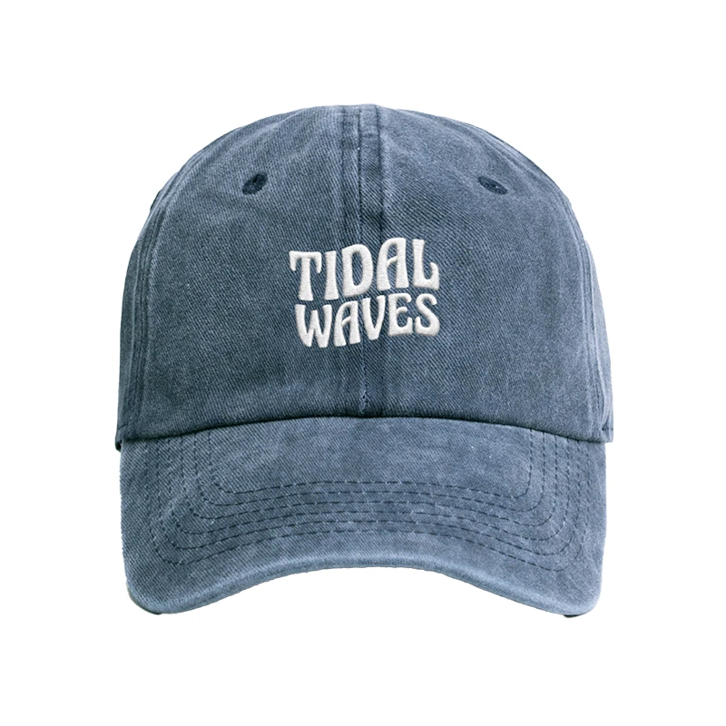 Enzyme-washed denim blue Tidal Waves dad cap with white embroidered logo on the front - Front view