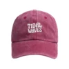 Enzyme-washed raspberry red Tidal Waves dad cap with white embroidered logo on the front - Front view
